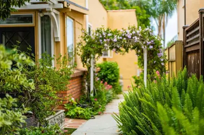 a garden with flowers and plants in front of a house at Sunlit La Jolla Village Gem with Peak Ocean Views in San Diego