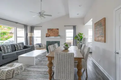 a living room with a table and chairs and a couch at Sunlit La Jolla Village Gem with Peak Ocean Views in San Diego