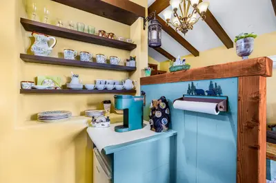 a kitchen with a blue cabinet with a sink at Spanish Style Cozy Studio in San Diego