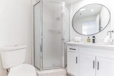 a bathroom with a shower and a toilet and a sink at Seas the Day by Cardo - La Jolla Beachfront in San Diego