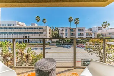a balcony with a view of a parking lot at Seas the Day by Cardo - La Jolla Beachfront in San Diego
