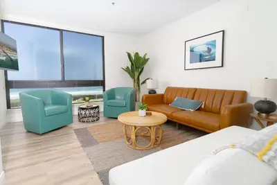 a living room with a couch and two chairs at Sunny on the Ocean - Beachfront- Pacific Beach in San Diego