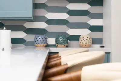 a room with vases on a shelf with a checkered wall at Sunny on the Ocean - Beachfront- Pacific Beach in San Diego