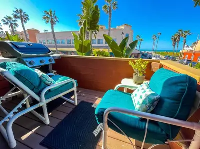a patio with two chairs and a grill on a deck at IB Seaside Paradise w/ Ocean Views! in Imperial Beach