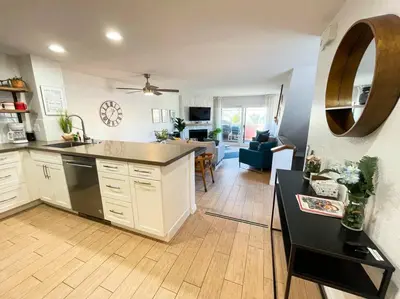 a kitchen with a counter top and a living room at IB Seaside Paradise w/ Ocean Views! in Imperial Beach
