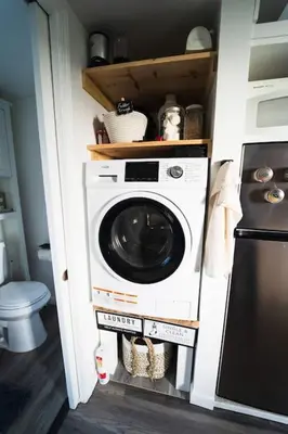 a washer and dryer in a kitchen with at TinyHome at the Sanctuary in Lakeside