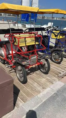 a three wheeled cart on a dock next to a boat at Beach Home W AC- 5 BR - Free Parking - EV Charge in San Diego