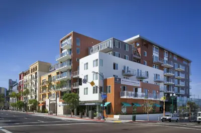 a tall building on a city street with a street at Little Italy studio w gym pool nr light rail SAN-6 in San Diego