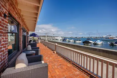 a balcony of a building with boats in the water at 608 S Bayfront in Newport Beach