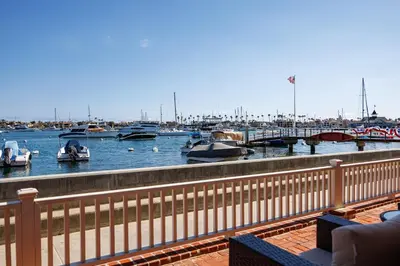 a view of a marina with boats in the water at 608 S Bayfront in Newport Beach