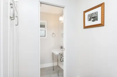 a bathroom with a sink and a mirror at 608 S Bayfront in Newport Beach
