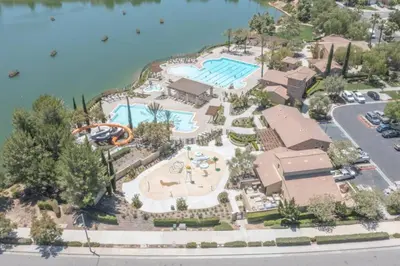 an aerial view of a pool at a resort at The Lake Stay in Menifee