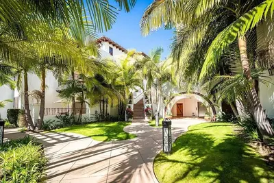 a house with palm trees and a walkway at Luxury Villa at Omni La Costa Resort & Spa in Carlsbad
