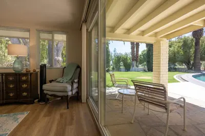a living room with a chair and a table at Poolside Splendor! Spacious De Anza Golf Club Home in Borrego Springs