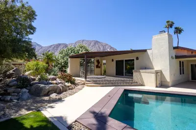 a house with a swimming pool in front of a house at Poolside Splendor! Spacious De Anza Golf Club Home in Borrego Springs