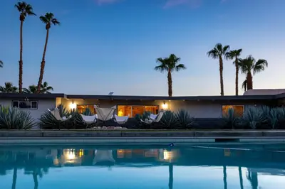 a house with a swimming pool at night with palm trees at Pool and Mtn View! Designer Borrego Springs Hideaway in Borrego Springs