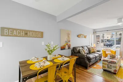 a living room with a table and a couch at Beach-2-Bay 1br - Mission Beach - AC - Shops in San Diego