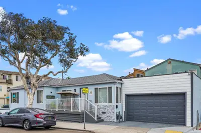 a house with a car parked in front of it at Beach-2-Bay 1br - Mission Beach - AC - Shops in San Diego