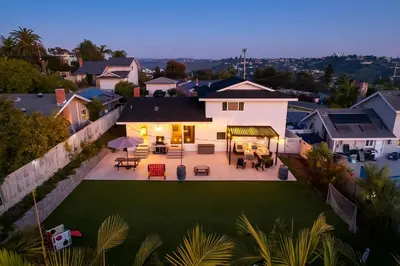 an aerial view of a house with a yard at 4Bd, Family Friendly, Fun Yard, Close to Beaches! in Oceanside