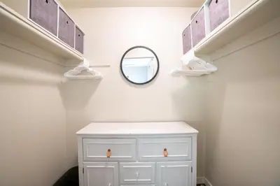 a bathroom with a white cabinet and a mirror at 4Bd, Family Friendly, Fun Yard, Close to Beaches! in Oceanside