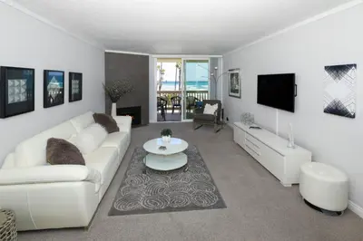 a living room with a white couch and a table at D206 Seaside Serenity in Oceanside