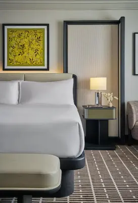 a hotel room with a bed and a couch at Pendry Newport Beach in Newport Beach
