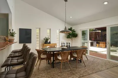 a dining room with a table and chairs at Coastal Retreat with E-Bikes! in Carlsbad
