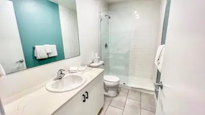 a bathroom with a sink and a toilet and a shower at Cozy Couple's Corner in Downtown San Diego in San Diego