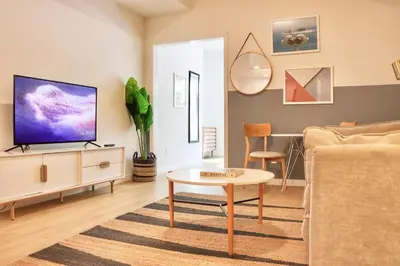 a living room with a couch and a table at Cozy Couple's Corner in Downtown San Diego in San Diego