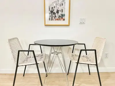 a black table and two chairs in a room at Executive Escape in Downtown San Diego in San Diego