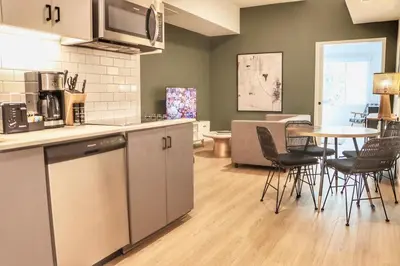 a kitchen and dining room with a table and chairs at Dapper Retreat in Vibrant San Diego in San Diego