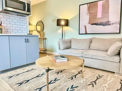a living room with a couch and a coffee table at Grand Downtown San Diego Apartment in San Diego