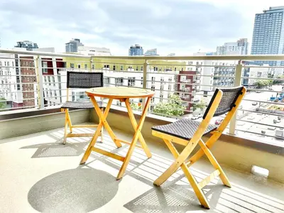 a table and two chairs on a balcony at The Leo - Unit 602 in San Diego