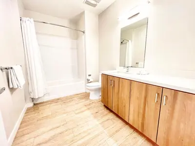 a bathroom with a sink and a toilet at San Diego Skyline - Downtown Apartment in San Diego