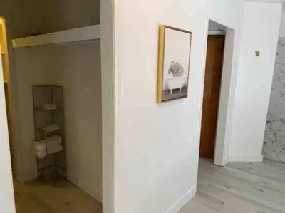 a white room with a mirror and a closet at The most breathtaking Lake and Mountain View in Fallbrook