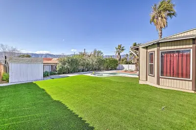 a large yard with a house and a swimming pool at Mtn-View Home Less Than 1 Mi to Lake Elsinore! in Lake Elsinore