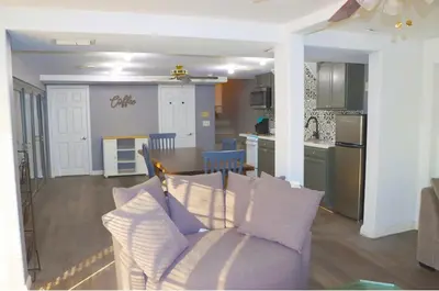 a living room and kitchen with a couch and a table at Mountain View Studio in Hemet