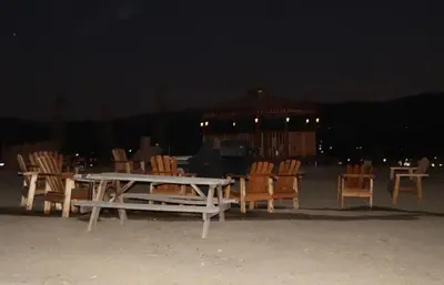 a group of chairs and a table and a gazebo at night at Mountain View Studio in Hemet