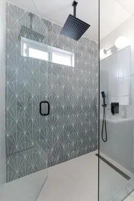 a shower with a glass door in a bathroom at Modern National City Studio in National City