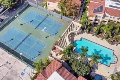 an overhead view of two tennis courts in a resort at -Vacation-Top corner 2-story one bedroom La Jolla Condo in San Diego