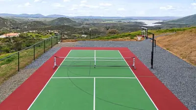 a tennis court on top of a hill at 20 Acre Panoramic View Estate Hot Tub Pickleball Game Room in Temecula