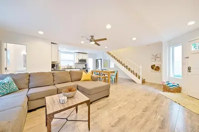 a living room with a couch and a table at La Jolla Beach Retreat Compound in San Diego