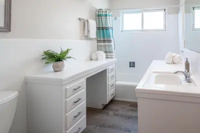 a white bathroom with a sink and a tub at CB-2445A - Carlsbad Casa De Los Sueños | Unit A in Carlsbad