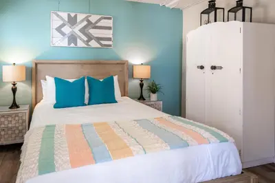 a bedroom with a large bed with blue walls at CB-2445B - Carlsbad Casa De Los Sueños | Unit B in Carlsbad
