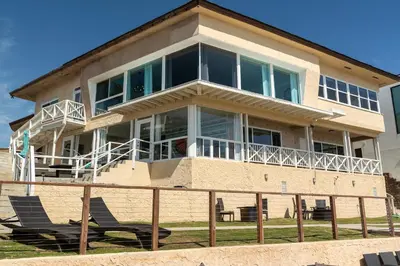 a large house with chairs in front of it at CB-2445B - Carlsbad Casa De Los Sueños | Unit B in Carlsbad