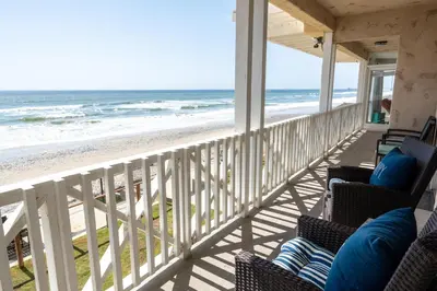 a balcony with chairs and a view of the beach at CB-2445C - Carlsbad Casa De Los Sueños | Unit C in Carlsbad