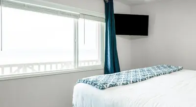 a bedroom with a white bed with a window at CB-2445C - Carlsbad Casa De Los Sueños | Unit C in Carlsbad