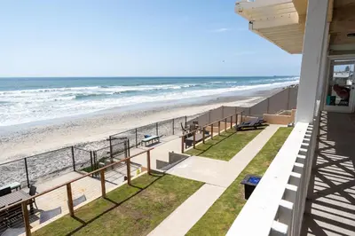 a view of the beach from the balcony of a beach house at CB-2445C - Carlsbad Casa De Los Sueños | Unit C in Carlsbad