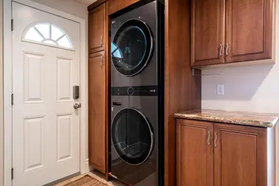 a kitchen with two washer and dryer at Stunning Oceanfront Home - Incredible Views in Oceanside
