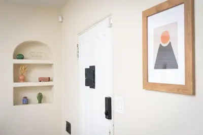 a door with a picture of a woman on the wall at Artfully-styled bungalow in the heart of it all in San Diego